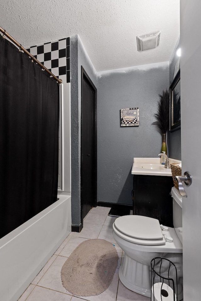 full bathroom with tile patterned flooring, visible vents, toilet, shower / bath combo with shower curtain, and a textured ceiling