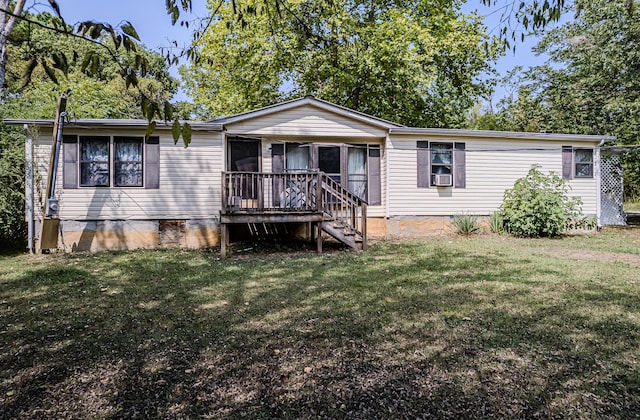 view of front of house with a front lawn, cooling unit, and a wooden deck