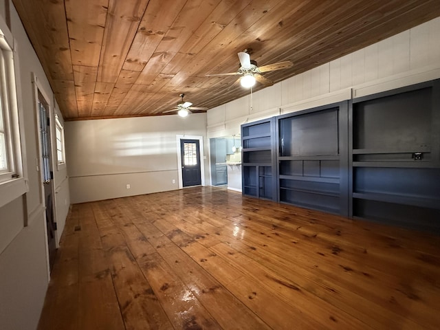 interior space featuring ceiling fan, hardwood / wood-style floors, and wooden ceiling