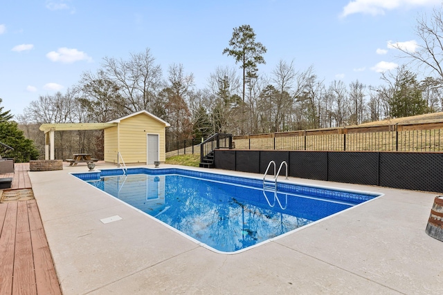 view of swimming pool featuring a shed