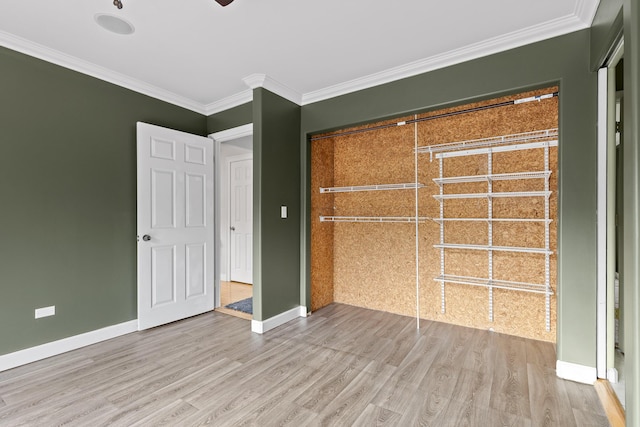 unfurnished bedroom with crown molding and wood-type flooring