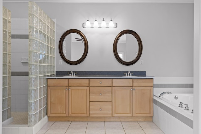 bathroom featuring vanity, tile patterned floors, and shower with separate bathtub