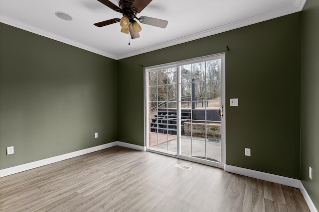 spare room featuring crown molding, light hardwood / wood-style flooring, and ceiling fan