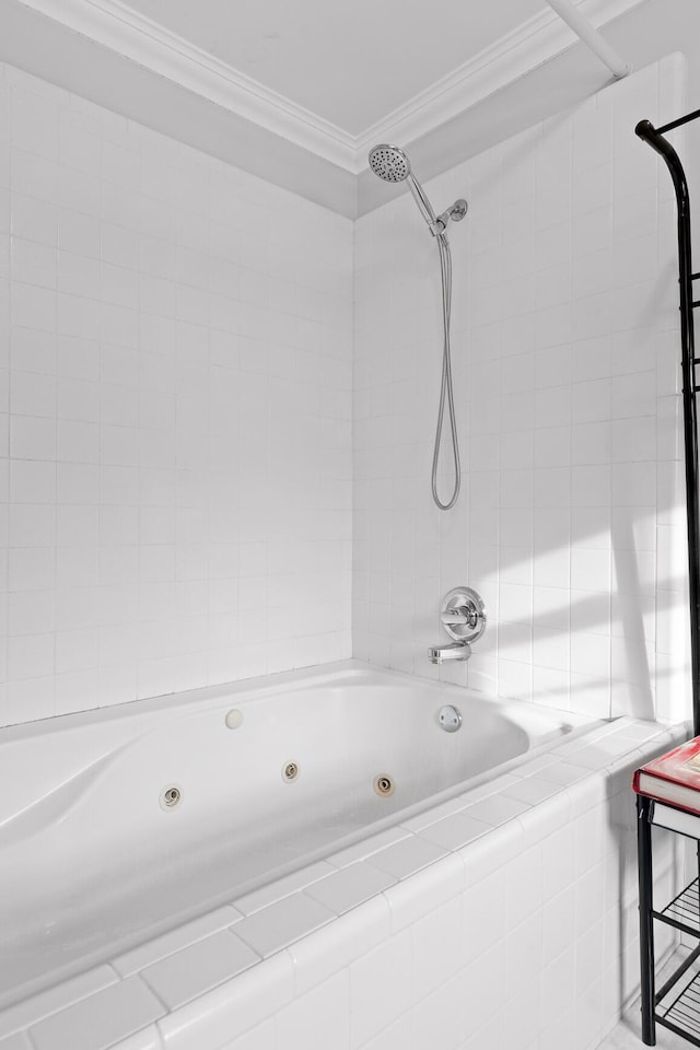 bathroom featuring tiled shower / bath combo and ornamental molding