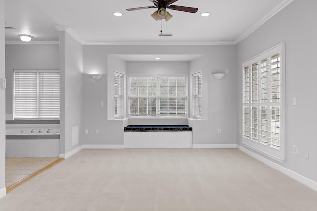 unfurnished living room featuring ceiling fan, ornamental molding, and carpet flooring