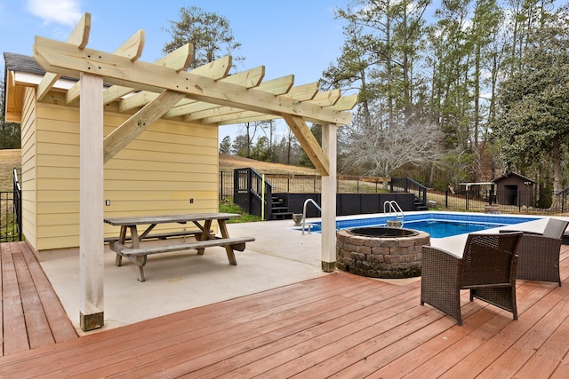 view of swimming pool featuring a deck and a pergola