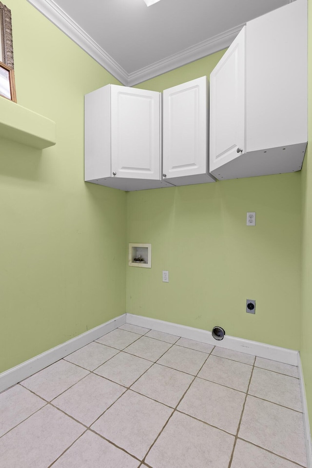 washroom featuring light tile patterned flooring, crown molding, cabinets, hookup for a washing machine, and hookup for an electric dryer