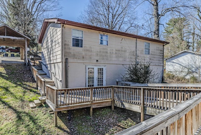 back of property with french doors and a wooden deck