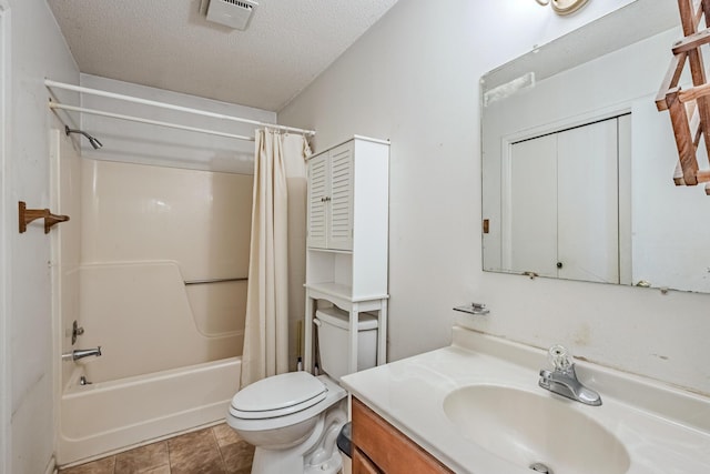 bathroom with a textured ceiling, toilet, vanity, visible vents, and shower / bathtub combination with curtain