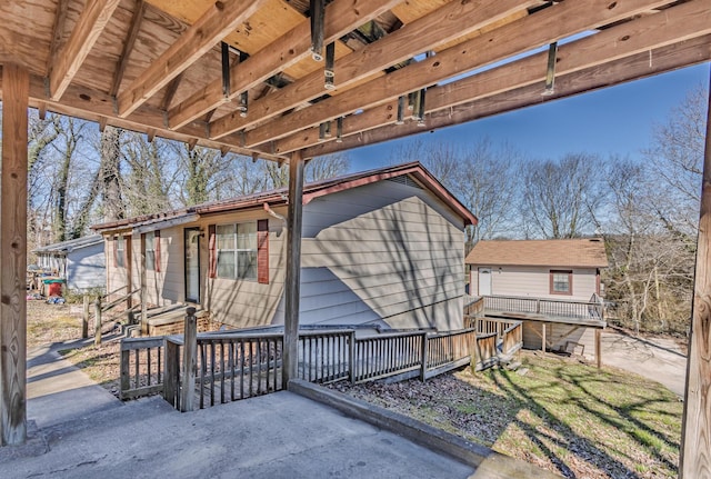 view of side of home featuring a wooden deck