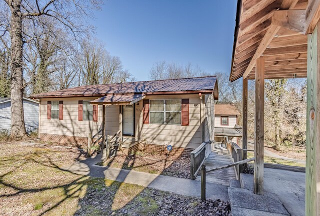 view of front of home featuring metal roof