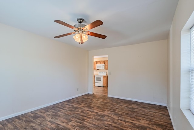 unfurnished room featuring ceiling fan, baseboards, and dark wood-style flooring