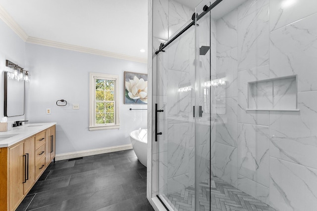 bathroom with double vanity, a marble finish shower, a sink, a freestanding tub, and ornamental molding
