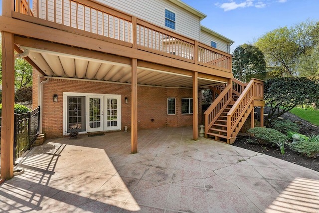 view of patio featuring stairway, a wooden deck, and french doors