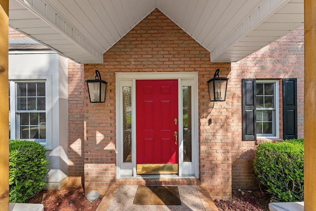 property entrance with brick siding