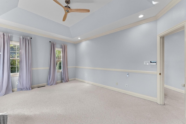 empty room featuring carpet flooring, baseboards, a ceiling fan, and visible vents