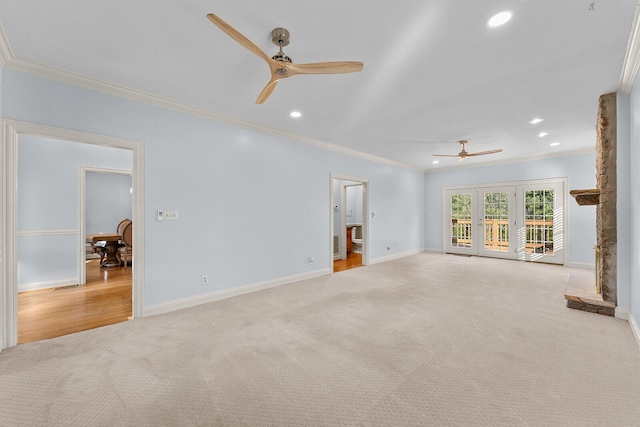 unfurnished living room featuring recessed lighting, baseboards, carpet flooring, ornamental molding, and ceiling fan