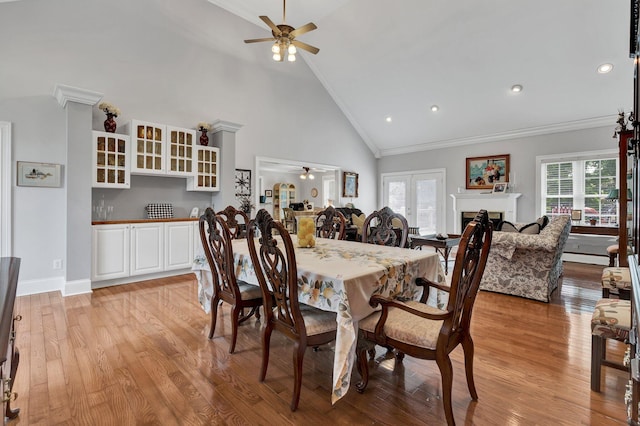 dining area with ceiling fan, light hardwood / wood-style flooring, and ornamental molding