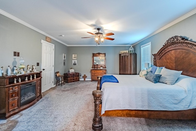 carpeted bedroom with ornamental molding and ceiling fan