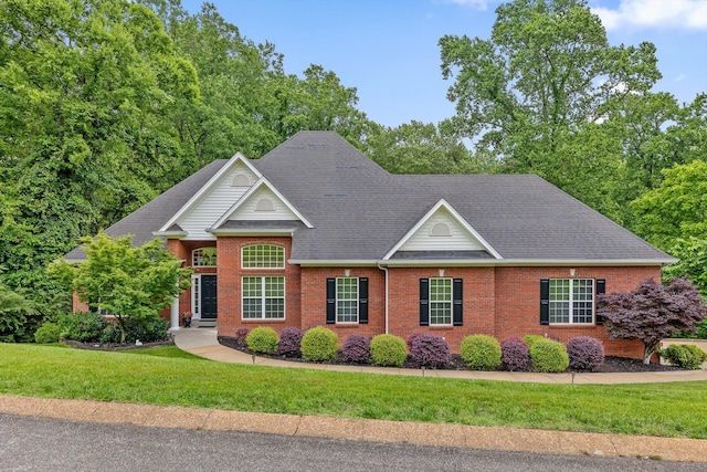 1607 Colonial Shores Dr, Hixson, TN 37343 - view of front of home featuring a front yard, brick siding, and a shingled roof