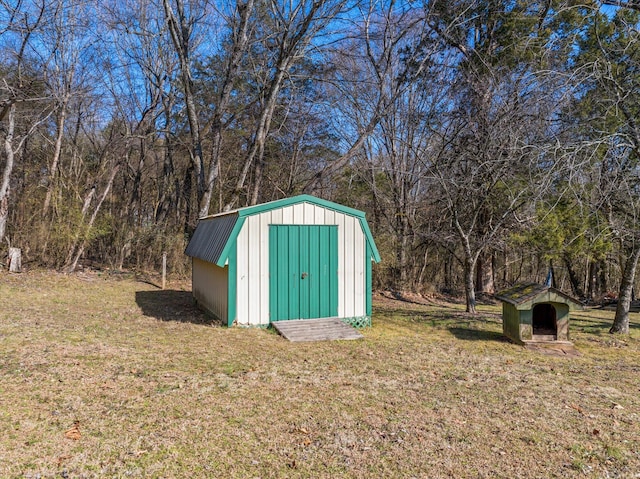 view of outbuilding with a lawn