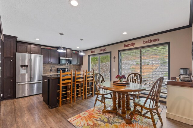 308 S Crisp Ln, Decatur, TN 37322 - dining room with ornamental molding, dark wood finished floors, and recessed lighting