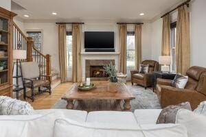 2560 Spring Creek Dr NE Lot 2 & 3, Cleveland, TN 37311 - living room featuring healthy amount of natural light, a lit fireplace, recessed lighting, and stairway