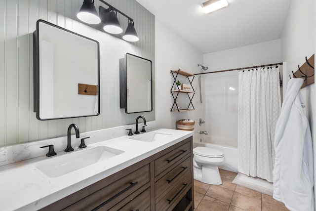 full bath with shower / tub combo with curtain, double vanity, a sink, and tile patterned floors