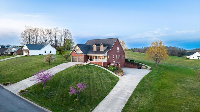 view of front facade featuring driveway, a front lawn, covered porch, brick siding, and a garage