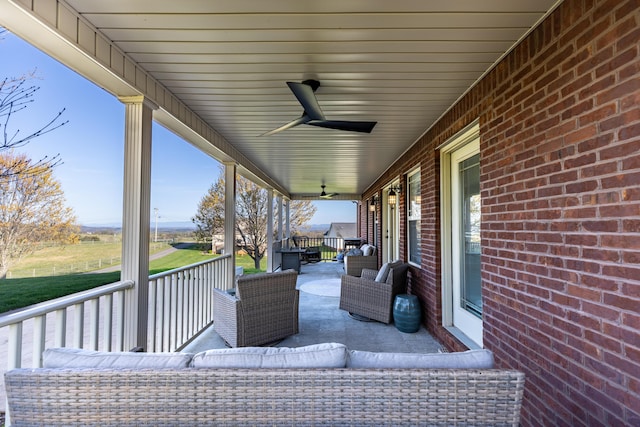 view of patio / terrace with a ceiling fan and a porch