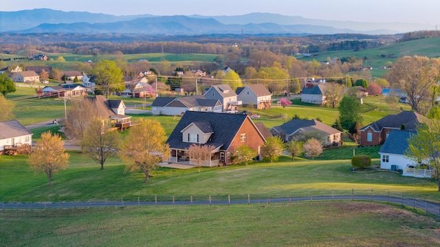 bird's eye view featuring a residential view, a rural view, and a mountain view