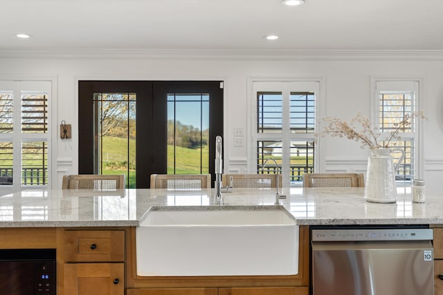 kitchen with ornamental molding, a sink, plenty of natural light, and dishwasher