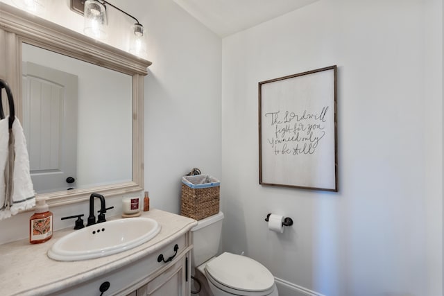 bathroom with toilet and vanity