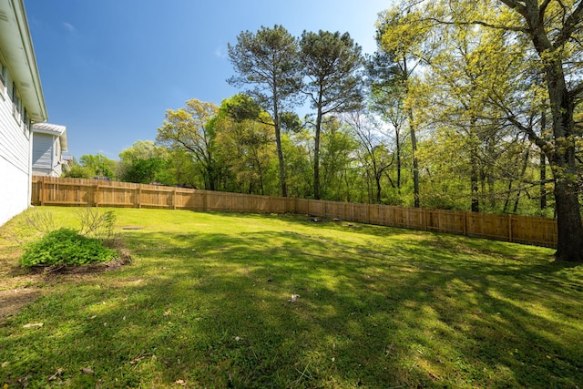 view of yard with a fenced backyard