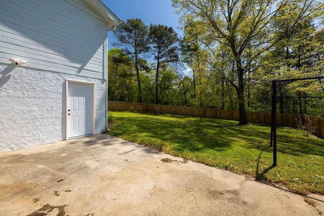 view of yard with a fenced backyard and a patio