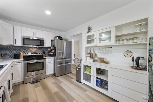 kitchen featuring white cabinets, light countertops, and appliances with stainless steel finishes