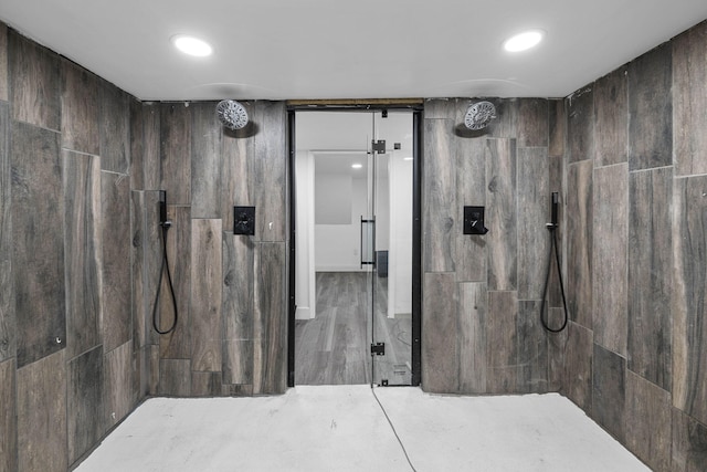 bathroom with recessed lighting and tiled shower