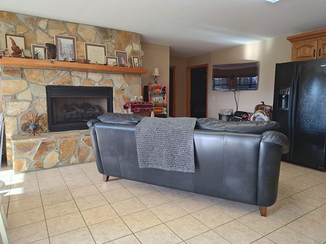156 Pine View Ln, Copperhill, TN 37317 - living room with light tile patterned floors and a stone fireplace