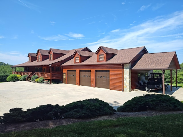 156 Pine View Ln, Copperhill, TN 37317 - view of front of property with driveway, an attached garage, a shingled roof, and faux log siding