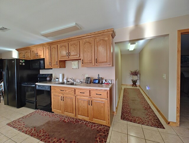 156 Pine View Ln, Copperhill, TN 37317 - kitchen featuring black appliances, light tile patterned floors, and light countertops