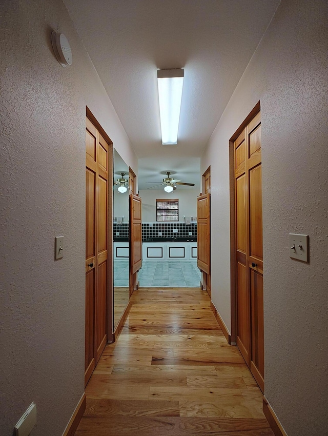 156 Pine View Ln, Copperhill, TN 37317 - corridor with light wood-style flooring and a textured wall
