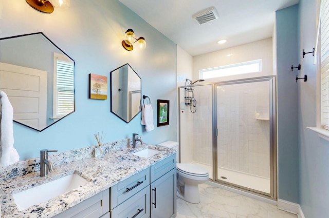 full bath featuring a shower stall, marble finish floor, a sink, and visible vents