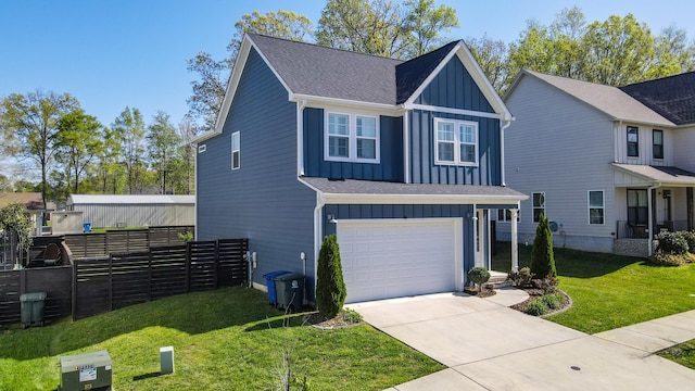view of front of home featuring driveway, board and batten siding, a front lawn, a garage, and fence
