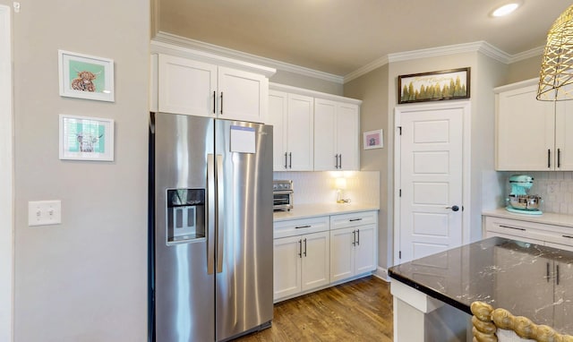 kitchen with stainless steel fridge with ice dispenser, tasteful backsplash, white cabinetry, crown molding, and wood finished floors