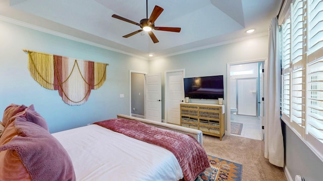 carpeted bedroom featuring crown molding, a tray ceiling, multiple windows, and recessed lighting