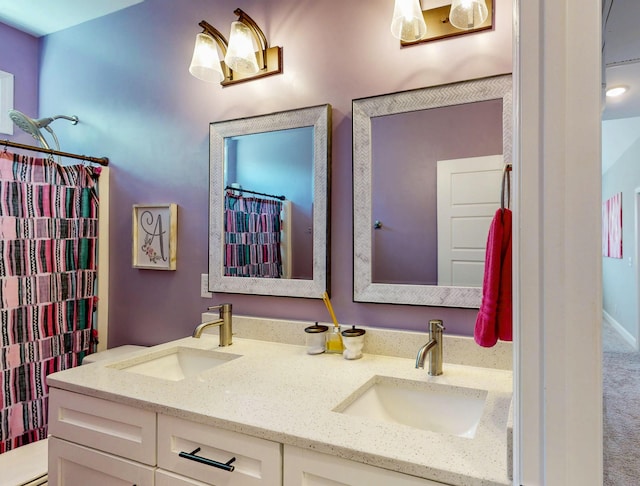 full bath featuring double vanity and a sink