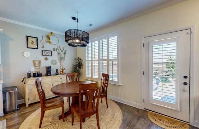 dining space with ornamental molding, baseboards, visible vents, and dark wood-style floors