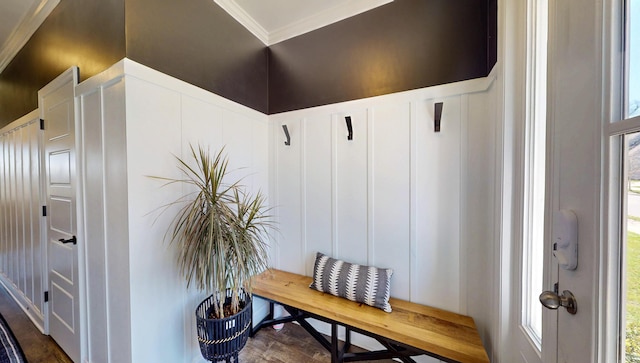 mudroom with a decorative wall, ornamental molding, wainscoting, and dark wood-style floors