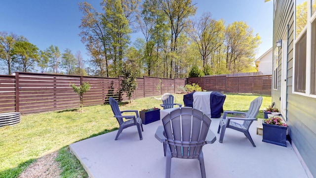 view of patio with a fenced backyard and grilling area