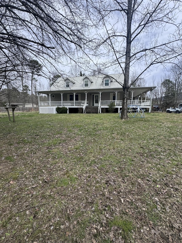 view of front of property with covered porch and a front yard